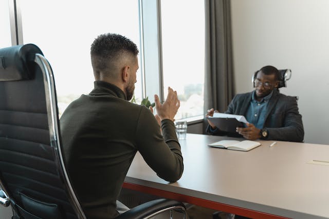 Two People Speaking in the Office